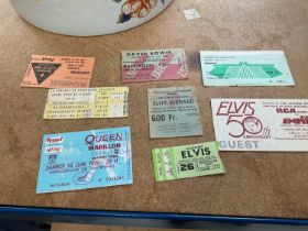 Group of concert tickets for Elvis Presley, David Bowie, Queen, etc, and three stamp albums