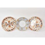 Pair of Wedgwood bone china plates, decorated in Imari style, and a saucer dish, decorated in pale b