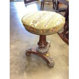 Victorian piano stool with floral embroidered seat on fluted turned column and trefoil base with scr