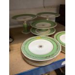 Victorian English porcelain dessert service on apple green ground and gilt decoration.