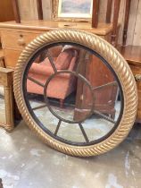 Impressive circular wall mirror in gilt frame