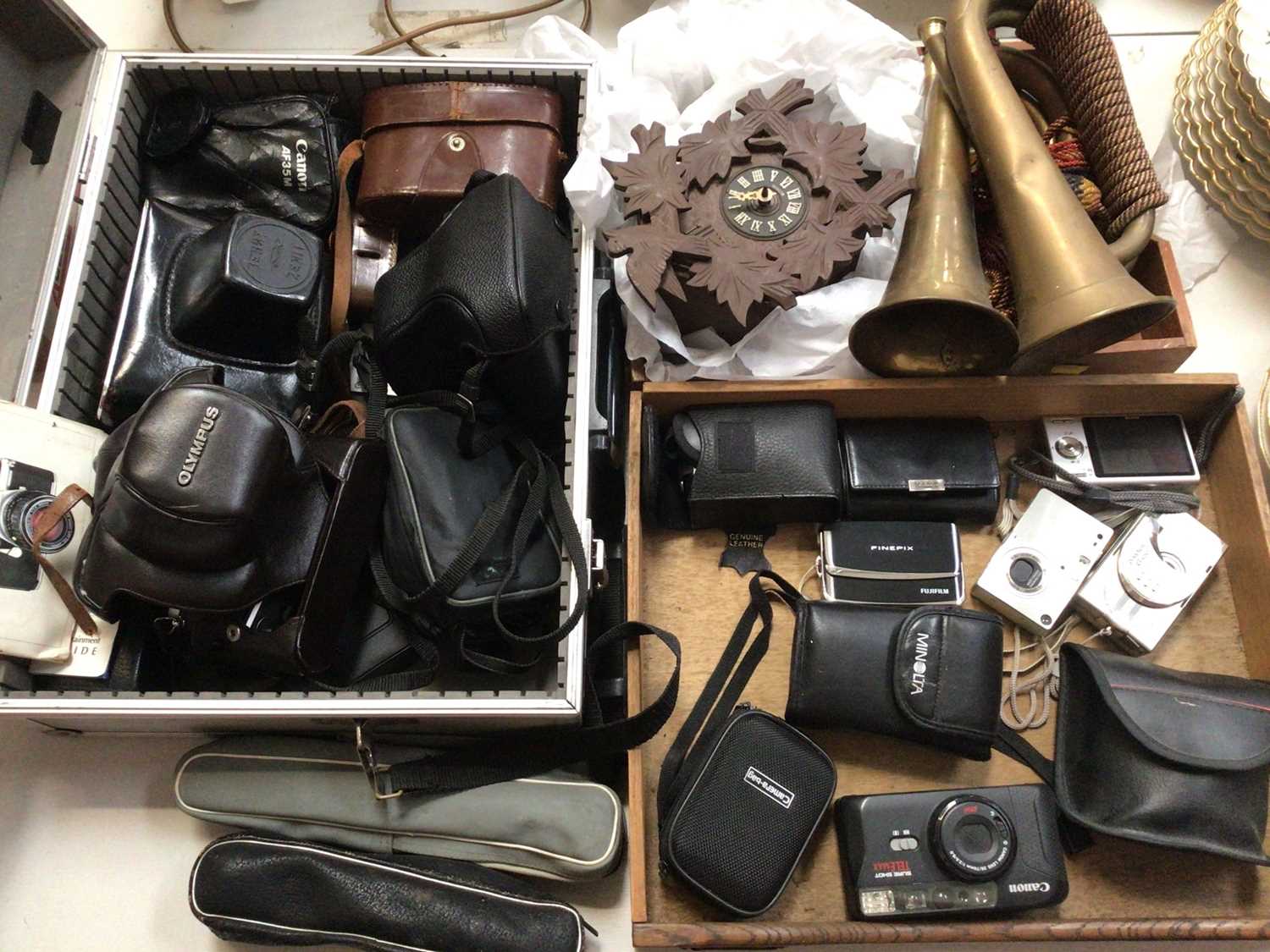 Selection of vintage cameras, digital cameras, accessories, a German cuckoo clock and two brass horn