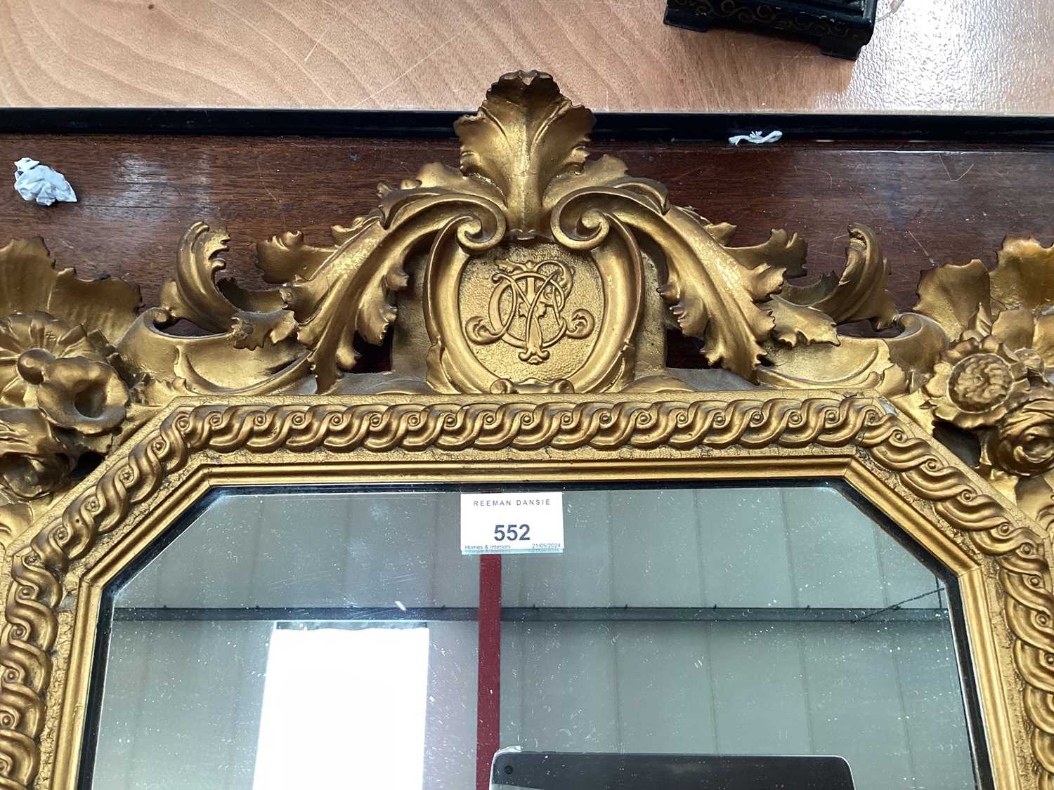 Antique carved giltwood decorative hanging mirror with central crest containing initials. - Image 2 of 4