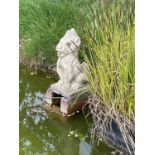 Pair of weathered concrete garden pond fountains in the form of gargoyles