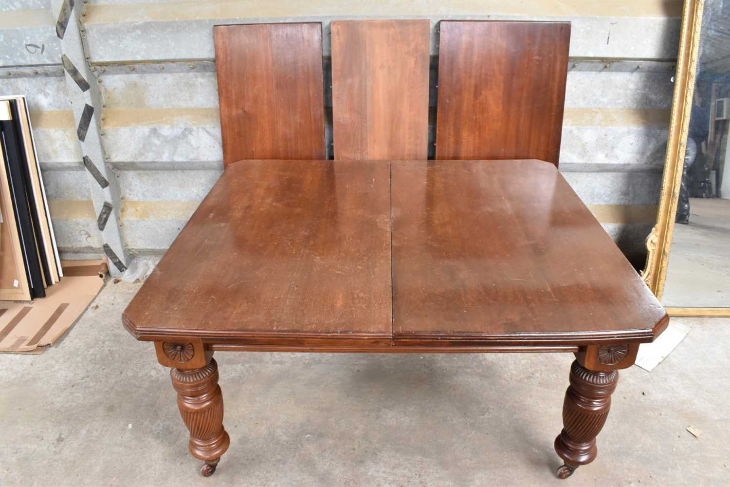 Very large Edwardian mahogany extending dining table, with three additional leaves