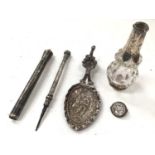 Dutch silver caddy spoon, silver and niello holder, propelling pencil and silver mounted scent bottl
