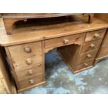 Modern pine kneehole desk with nine drawers, 127cm wide, 64cm deep, 78cm high