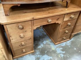 Modern pine kneehole desk with nine drawers, 127cm wide, 64cm deep, 78cm high