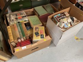 Group of mixed books and a collection of match boxes.