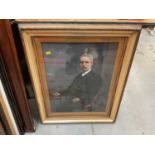 Early 20th century overpainted portrait photograph of a man in glazed gilt frame.