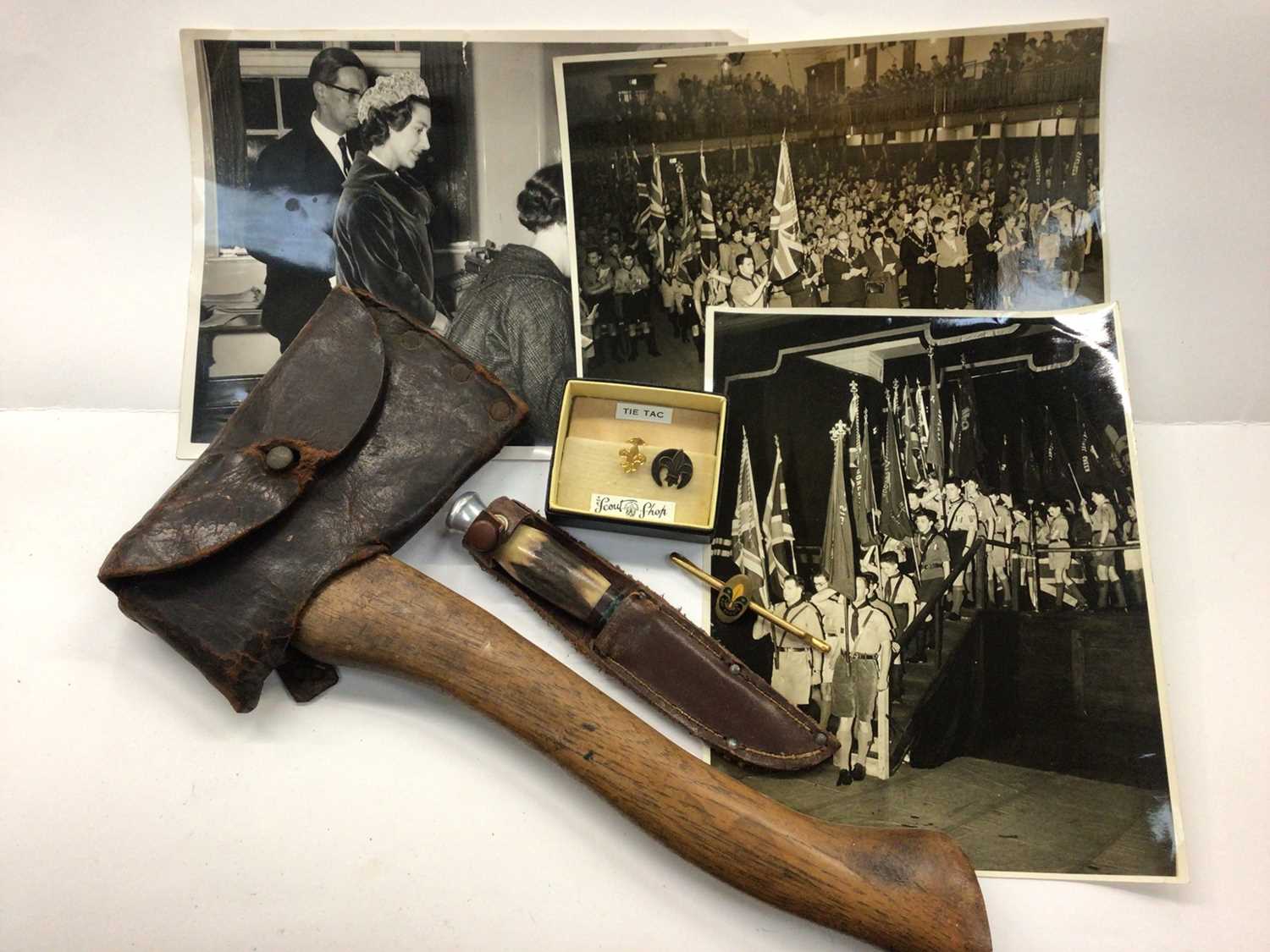 Boy Scouts axe with leather cover, Scouts pins, related photographs and a hunting knife