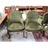 Set of four 1920’s green upholstered tub chairs on carved cabriole front legs with claw and ball fee