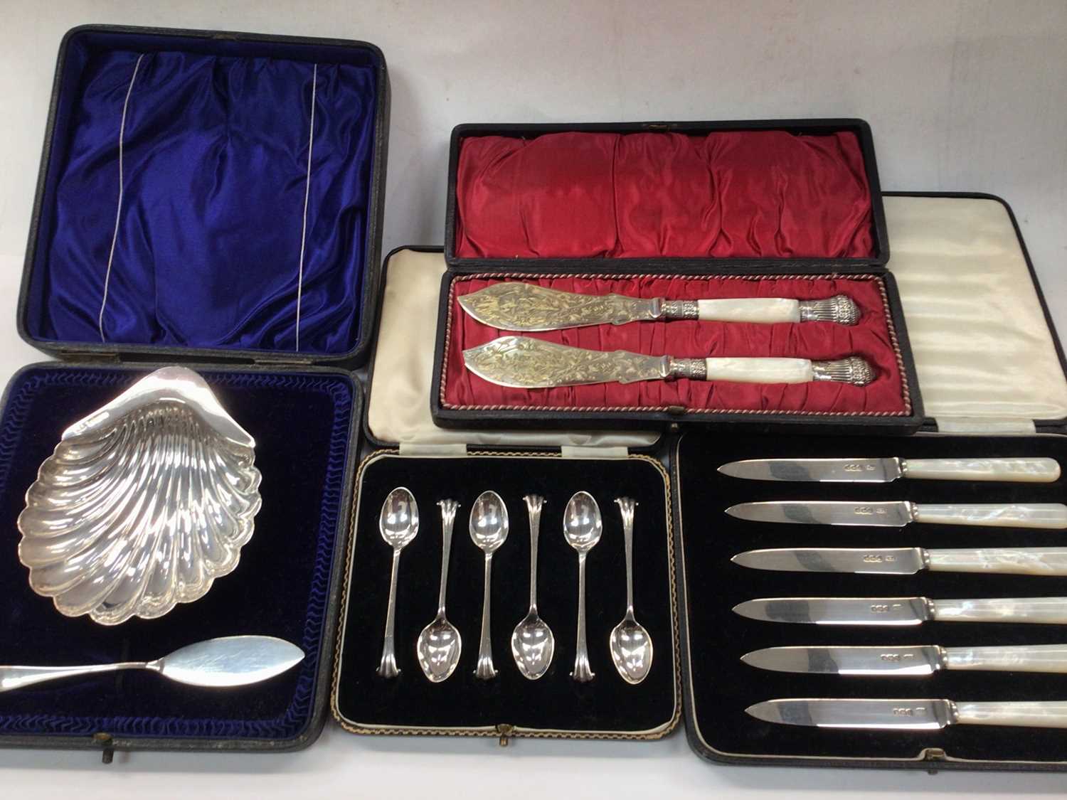 Silver shell butter dish and knife, set of six silver coffee spoons, set of six silver and mother of