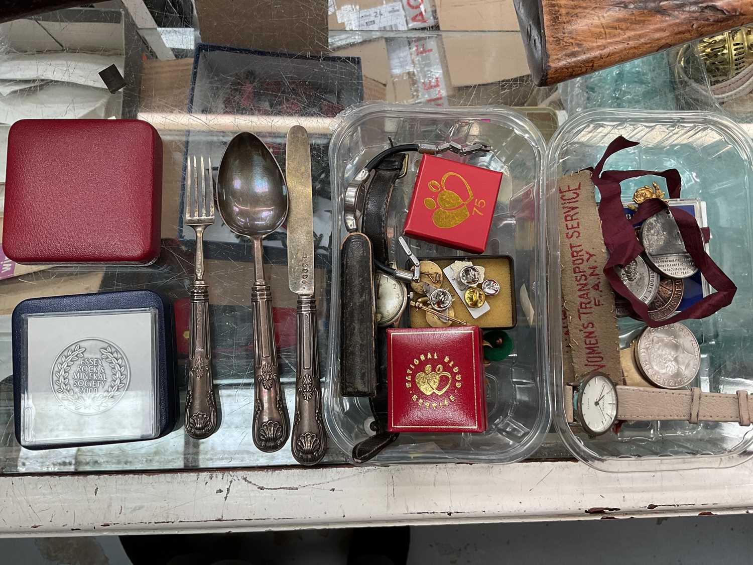 Sundry collectables, including watches, medals, badges, and a set of silver handled cutlery
