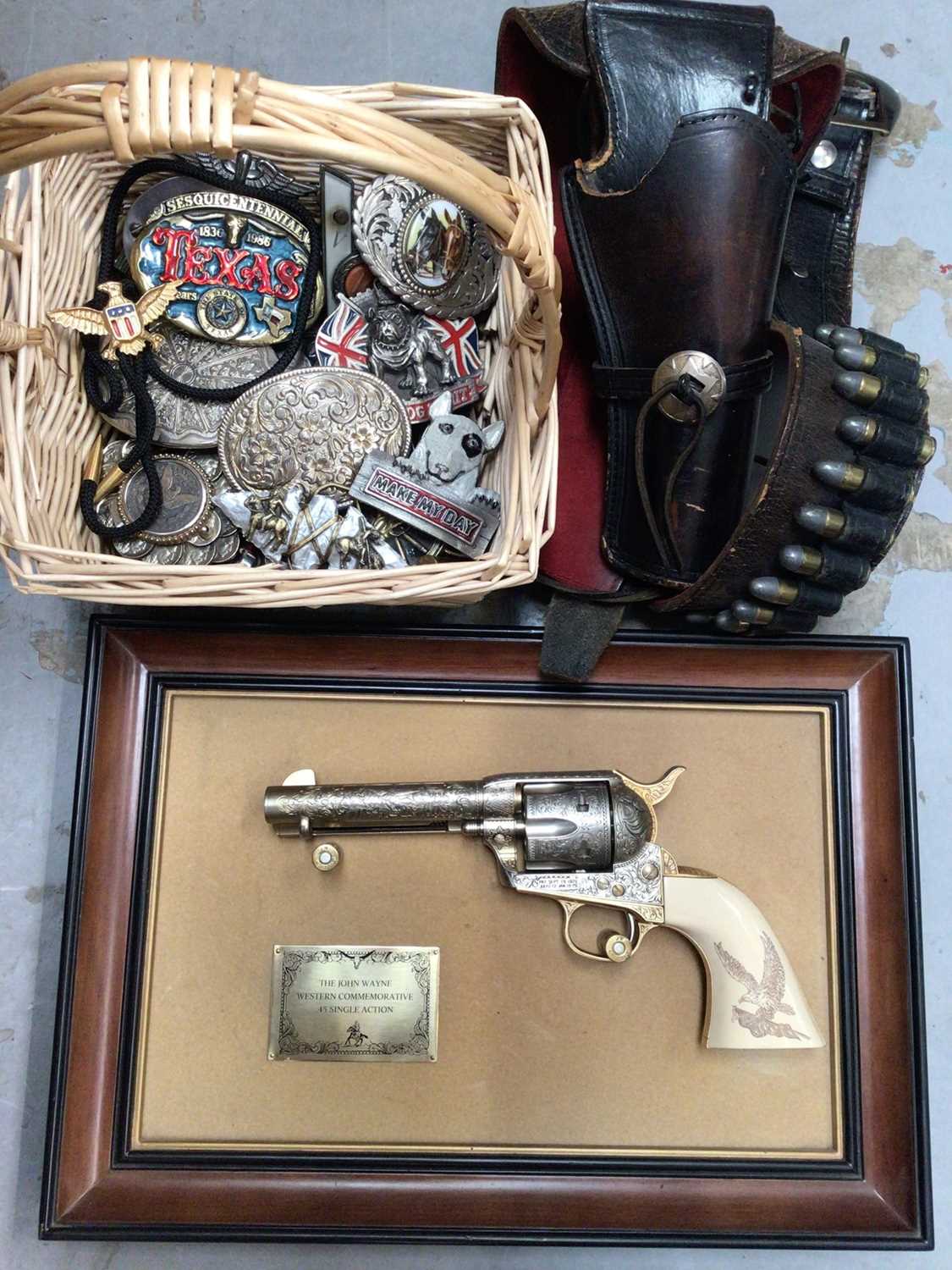 John Wayne replica gun, leather holster, various belt buckles, penknives, lighters etc