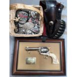 John Wayne replica gun, leather holster, various belt buckles, penknives, lighters etc