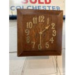 Art Deco oak wall clock with applied brass numerals, in working condition (with key and pendulum)