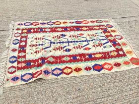 Kilim rug with geometric decoration on cream, blue, red and green ground, 190cm x 132cm