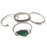 Silver bangle with green enamelled leaf decoration together with other three silver/white metal bang