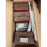 Three boxes of pigeon clocks, including Toulet