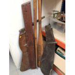 Pair of wooden rowing oars and two wooden sailboat rudders