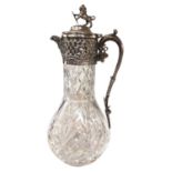 Cut glass claret jug with silver plated mounts and a lion holding a shield terminal