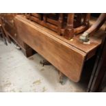 19th century mahogany drop leaf table with end drawer on turned column and four splayed legs, 107cm