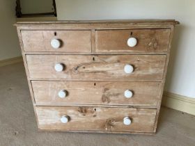 Victorian pine chest of two short and three long drawers, with ceramic bun handles