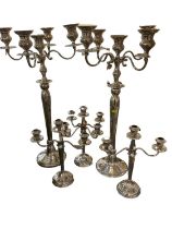 Pair of modern silvered tall candelabra and pair of small silvered candlesticks
