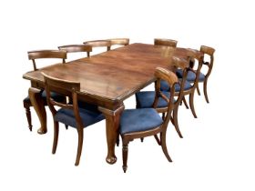 Early 20th century mahogany extending dining table together with a matched set of eleven 19th centur