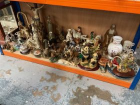 Large group of predominantly resin ornaments and figures including dogs, fairies and others.