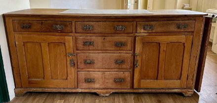 Antique pine dresser base with an arrangement of cupboards and drawers, inset marble panel to top an