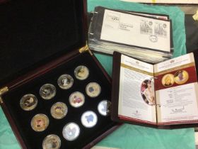 Group of commemorative coins in albums, First Day Covers