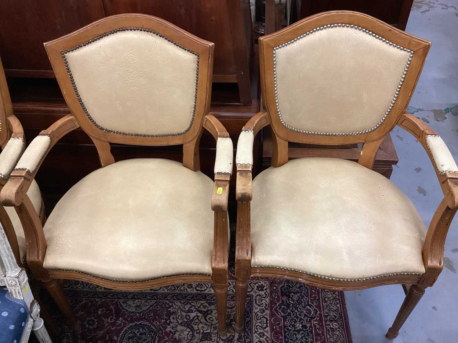 Set of four French style elbow chairs with studded beige upholstery