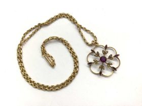 Edwardian amethyst and seed pearl floral pendant on 15ct gold chain with barrel clasp, 48.5cm long