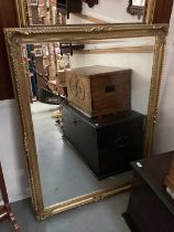 Large bevelled wall mirror in ornate gilt frame