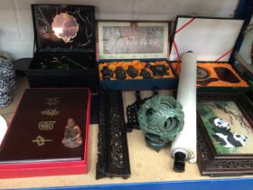 Group of Chinese items, including a hardstone puzzle ball, figure of Guanyin, embroidery, etc