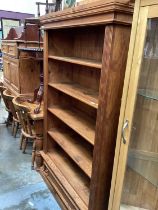 Pine two height open bookcase with drawer below