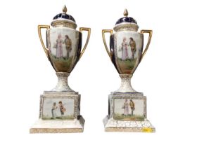 Pair of Continental porcelain urns and covers on plinths, decorated with romantic figures