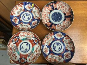 Four antique Japanese imari plates
