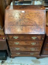 Early 20th century Georgian style burr walnut bureau with fitted interior and four drawers below, 61