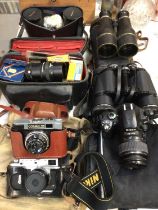 Group of vintage cameras and binoculars