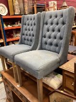 Pair of side chairs with buttoned blue upholstery