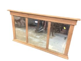 Pine framed overmantel mirror with three bevelled plates, 108cm x 58cm