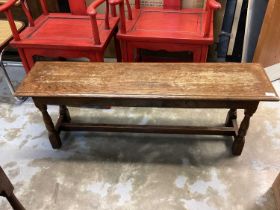 Long oak stool on turned and block legs joined by stretchers, 121cm wide, 31.5cm deep, 44cm high