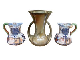 Pair of 19th century Davenport jugs with serpent handles, together with an English pottery lustre va