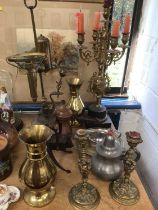 Group of metalware, including a large Gothic-style brass candelabra and similar pair of candlesticks