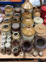 Collection of stoneware flagons, jars, kitchen items, etc