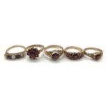 9ct gold garent and seed pearl five stone ring and four other 9ct gold garent rings (5)