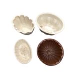 Four Victorian stoneware jelly moulds / Capodimonte cup and saucer, Limoges coffee can and saucer, C
